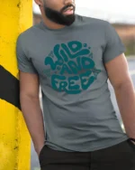 Wild And Free Retro Typography Graphic Tee Adventure Vibes - model wearing grey tee, leaning on column