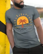 Retro Summer Vacation Sunset Palm Graphic Tee Beach Style - model wearing grey tee, leaning on column