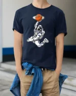 Astronaut Basketball Planet Graphic Tee Space Sports Style - model wearing navy tee with hands in pockets