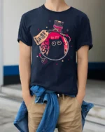 Funny Magic Potion Cat Graphic Tee Cute Mystery Style Art - model wearing navy tee with hands in pockets