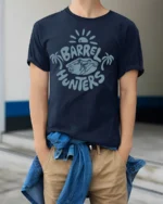 Barrel Hunters Surf Graphic Tee Beach Wave Rider Style - model wearing navy tee with hands in pockets