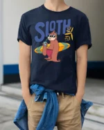 Funny Sloth Surfing Graphic Tee Chill Beach Vibes Tshirt - model wearing navy tee with hands in pockets