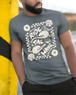Ride The Wave Graphic Tee Retro Beach Surf Style Tshirt - model wearing grey tee, leaning on column