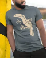 Tropical Toucan Bird Graphic Tee Minimal Jungle Nature Tshirt - model wearing grey tee, leaning on column