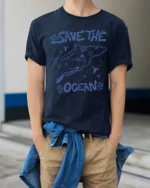 Save The Ocean Whale Diver Conservation Graphic Tee - model wearing navy tee with hands in pockets