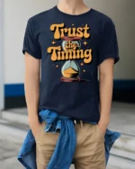 Trust The Timing Retro Hourglass Motivational Graphic Tee - model wearing navy tee with hands in pockets