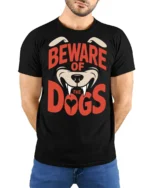 Beware Of The Dogs Funny Guard Dog Graphic Tee Bold Style - model wearing black tee with hands behind back
