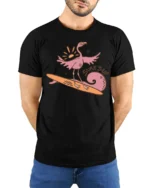 Surfing Flamingo Surfs Up Beach Vibes Funny Graphic Tee - model wearing black tee with hands behind back