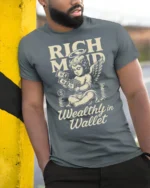 Rich Mind Wealthy Wallet Angel Money Vintage Graphic Tee - model wearing grey tee, leaning on column