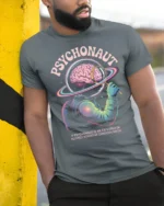 Psychonaut Cosmic Mind Explorer Astronaut Graphic Tee - model wearing grey tee, leaning on column