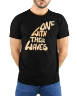 One With The Waves Ocean Vibe Surf Lifestyle Graphic Tee Cool Tshirt - model wearing black tee with hands behind back