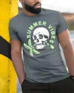 Summer Vibes Skull Palm Tree Graphic Tee Funny Beach Style Tshirt - model wearing grey tee, leaning on column