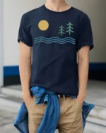 Minimal Nature Landscape Sun Waves Pine Trees Graphic Tee Tshirt - model wearing navy tee with hands in pockets