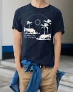 Go Where You Feel Most Alive Palm Beach Graphic Tee Tshirt - model wearing navy tee with hands in pockets