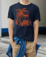 Tropical Beach House Sunset Palm Tree Vacation Graphic Tee Tshirt - model wearing navy tee with hands in pockets