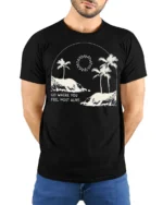 Go Where You Feel Most Alive Palm Beach Graphic Tee Tshirt - model wearing black tee with hands behind back