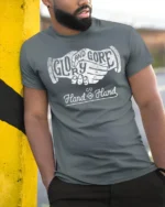 Glory And Gore Go Hand In Hand Vintage Handshake Graphic Tee Tshirt - model wearing grey tee, leaning on column