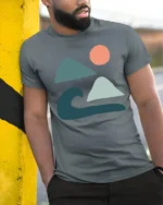 Minimal Ocean Wave Mountain Sun Abstract Art Graphic Tee Tshirt - model wearing grey tee, leaning on column