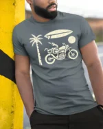 Retro Beach Motorcycle Surfboard Palm Tree Graphic Tee Tshirt - model wearing grey tee, leaning on column