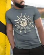 Stoked Surf Sun Retro Beach Vibes Graphic Tee Tshirt - model wearing grey tee, leaning on column