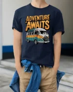 Adventure Awaits Van Life Graphic T Shirt Retro Travel Tee - model wearing navy tee with hands in pockets