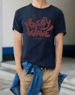 Baby Wave Club Surf Graphic T Shirt Retro Beach Vibe Tee - model wearing navy tee with hands in pockets
