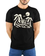 Tropical Wave Palm Tree Graphic T Shirt Sunset Beach Vibe Tee - model wearing black tee with hands behind back