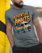 Adventure Awaits Van Life Graphic T Shirt Retro Travel Tee - model wearing grey tee, leaning on column