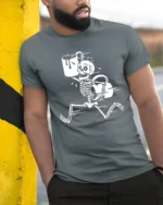 Funny Skeleton Coffee Run Graphic T Shirt Dark Humor Tee - model wearing grey tee, leaning on column