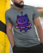 Cute Space Cat Alien Graphic T Shirt Kawaii Cosmic Tee - model wearing grey tee, leaning on column