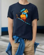 Colorful Kingfisher Bird Graphic T Shirt Vibrant Nature Tee - model wearing navy tee with hands in pockets