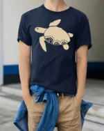 Minimal Sea Turtle Tribal Art Graphic Tee Ocean Vibe Tshirt - model wearing navy tee with hands in pockets