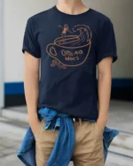 Coffee And Waves Surf Vibe Graphic Tee Beach Lover Tshirt - model wearing navy tee with hands in pockets