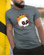 Funny Skull Crown Graphic T Shirt Cartoon King Skull Tee - model wearing grey tee, leaning on column
