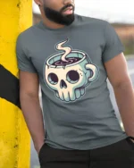 Skull Coffee Mug Graphic T Shirt Dark Humor Caffeine Tee - model wearing grey tee, leaning on column