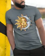 Sun Moon Celestial Face Graphic T Shirt Cosmic Balance Tee - model wearing grey tee, leaning on column