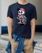 Funny Skateboarding Skeleton With Lollipop Cute Cartoon T Shirt - model wearing navy tee with hands in pockets
