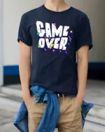 Game Over Funny Retro Gaming Typography Graphic T Shirt - model wearing navy tee with hands in pockets
