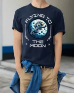 Flying To The Moon Astronaut Space Adventure Graphic T Shirt - model wearing navy tee with hands in pockets