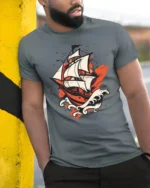 Vintage Sailing Ship Ocean Adventure Bold Graphic T Shirt - model wearing grey tee, leaning on column