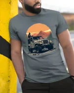Off Road Jeep Adventure Mountain Sunset Outdoor Graphic T Shirt - model wearing grey tee, leaning on column