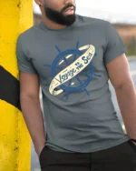 Voyage To The Sea Nautical Ship Wheel Vintage Style T Shirt - model wearing grey tee, leaning on column