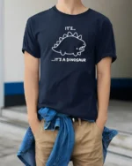 Funny Its A Dinosaur Cute Cartoon Minimal Humor T Shirt - model wearing navy tee with hands in pockets