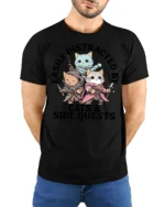 Easily Distracted By Cats And Side Quests Funny Gamer T Shirt - model wearing black tee with hands behind back