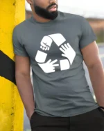 Funny Rock Paper Scissors Recycle Symbol Humor T Shirt - model wearing grey tee, leaning on column