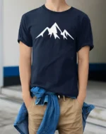 Minimalist Mountain Peak Nature Adventure Graphic T Shirt - model wearing navy tee with hands in pockets