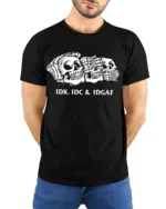 Sarcastic Skull Trio IDK IDC IDGAF Humor Graphic Tee Shirt - model wearing black tee with hands behind back