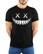 Creepy Smile Skull Face X Eyes Minimalist Graphic T Shirt - model wearing black tee with hands behind back