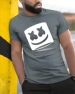 DJ Marshmallow Smile Face Minimalist Music Graphic T Shirt - model wearing grey tee, leaning on column