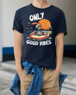 Only Good Vibes Skeleton Pool Float Sunset Graphic T Shirt - model wearing navy tee with hands in pockets